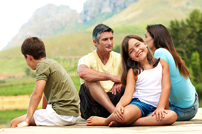 Buy stock photo Girl, smile and family on pier for travel, together or bonding with summer vacation in nature. People, parents and female kid with brother for holiday break, relax and portrait outdoor for fresh air