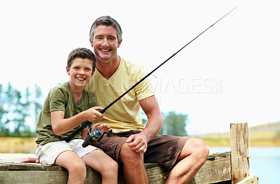 Buy stock photo Dad, kid and fishing at lake with care on vacation together, teaching or smile at pier with portrait. Parent, boy or rod by water outdoor to relax, learning or bonding for happiness on holiday