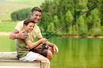Buy stock photo Smile, father and child at lake for fishing, adventure and teaching skills for casting technique. Happy, man and help kid in nature with rod, family tradition and reel guidance for fisherman vacation