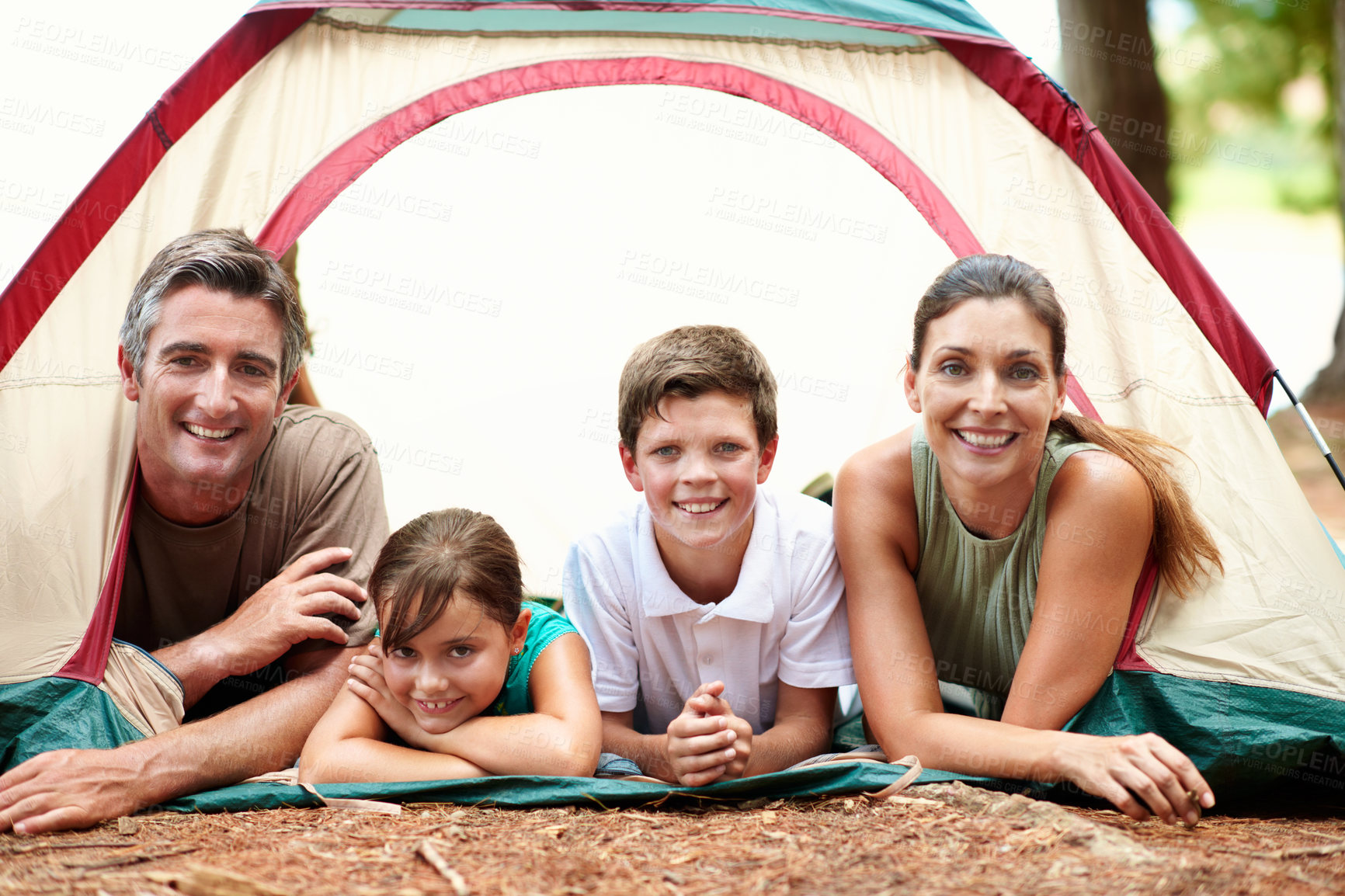 Buy stock photo Portrait, parents and children with tent for camping, relax and bonding together for summer holiday. Happy family, mother and father outdoor at campsite with kids, weekend or vacation for connection.