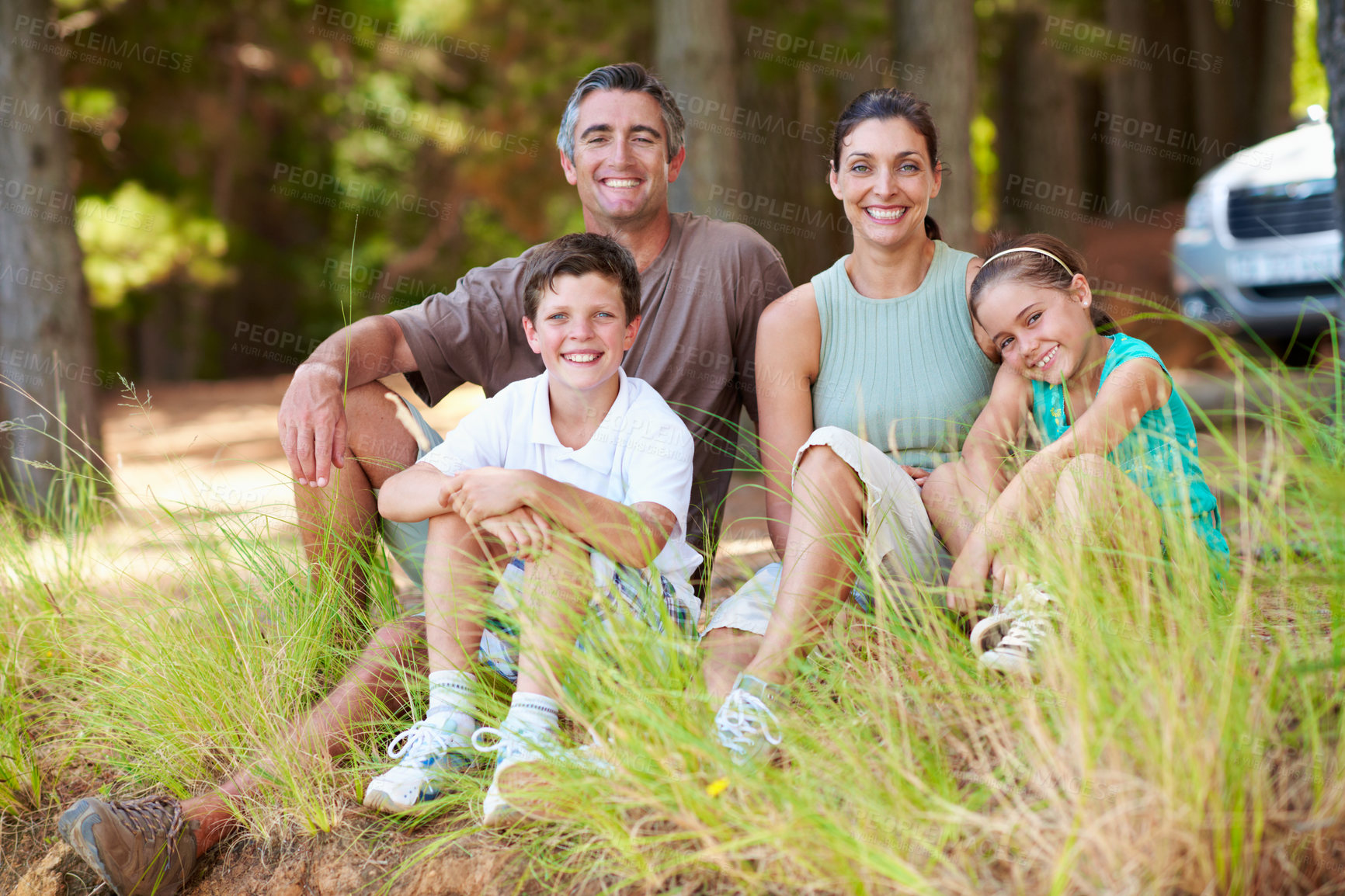 Buy stock photo Holiday, parents or children in forest with portrait, bonding together or connection on summer vacation. Smile, siblings or family with love, happy moment or healthy relationship on outdoor getaway.