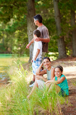 Buy stock photo Family, camping and smile in forest for vacation with love, bonding and relax in nature together. Mother, father and children with portrait in woods for holiday, summer trip and wilderness for travel