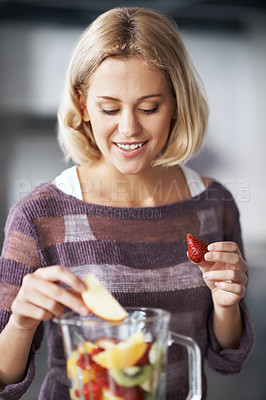Buy stock photo A young woman with a homemade smoothie