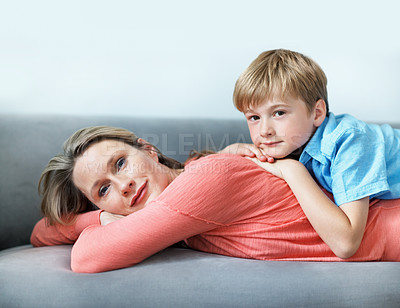 Buy stock photo Portrait, mother and relax on couch with child, love and affection for bonding together. Happy, woman and embrace in living room with kid, family connection and comfortable for weekend break at house
