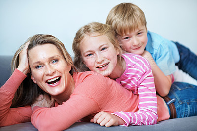 Buy stock photo Portrait, stack and mom with children in house, love and bonding with smile on break and connection. Family, pile and happy woman with kids, childcare and single parent with pride in Australia