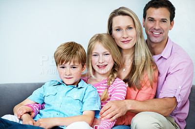 Buy stock photo Love, parents and children on sofa with portrait, security or bonding together on weekend break. Support, space or family with embrace, happy moment or sibling connection in relationship in home