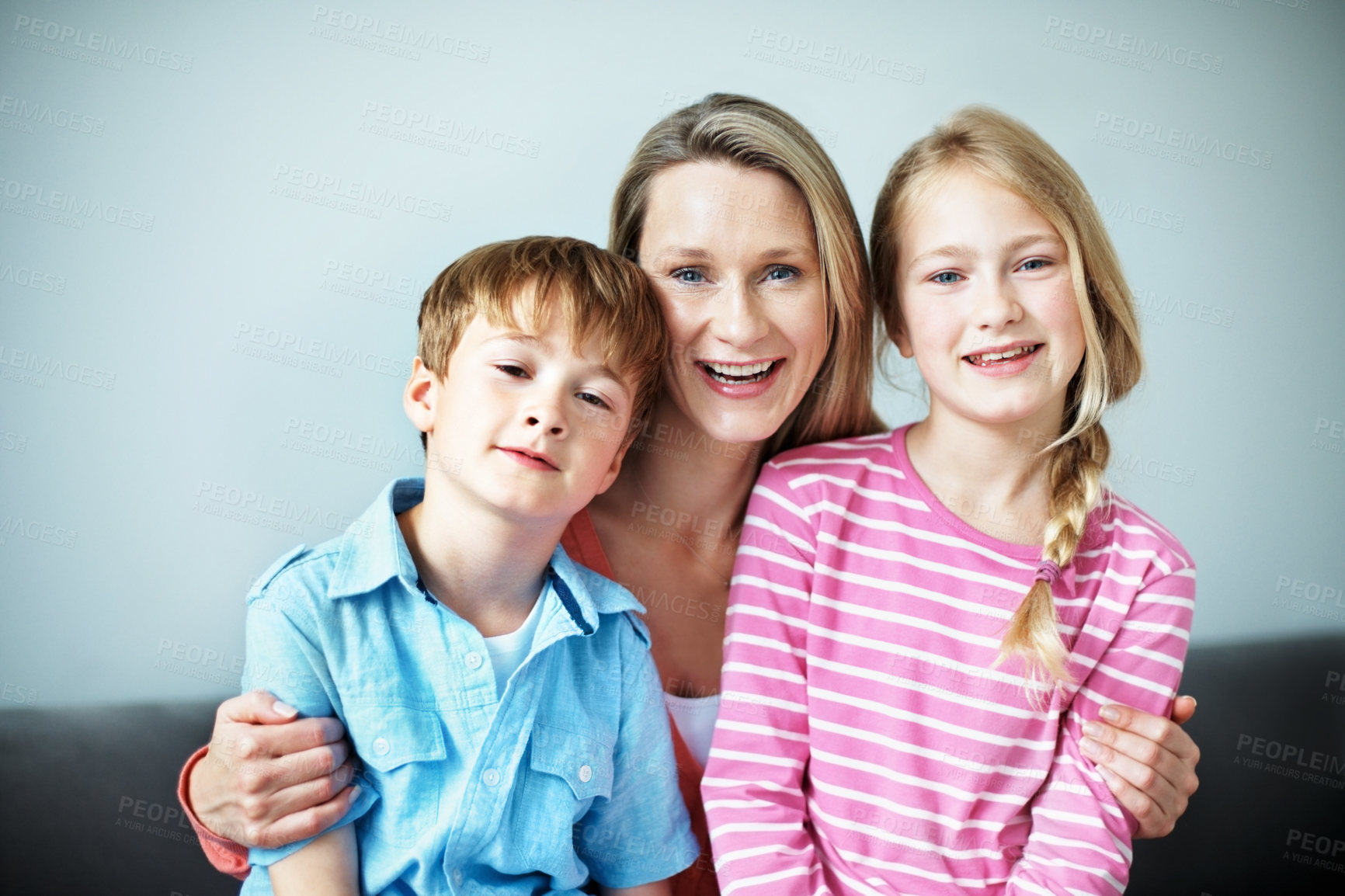 Buy stock photo Portrait, hug and mom with children in lounge, family and bonding with smile on break or connection. Happy woman, home and affection for kids, childcare and single parent with pride in Australia