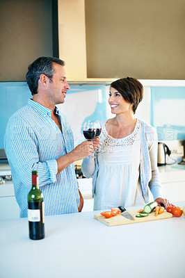 Buy stock photo Cooking, happy couple and toast with wine, bonding or celebration with partner on weekend in kitchen. Laughing, people and cheers with alcohol, anniversary and meal prep with ingredients in house