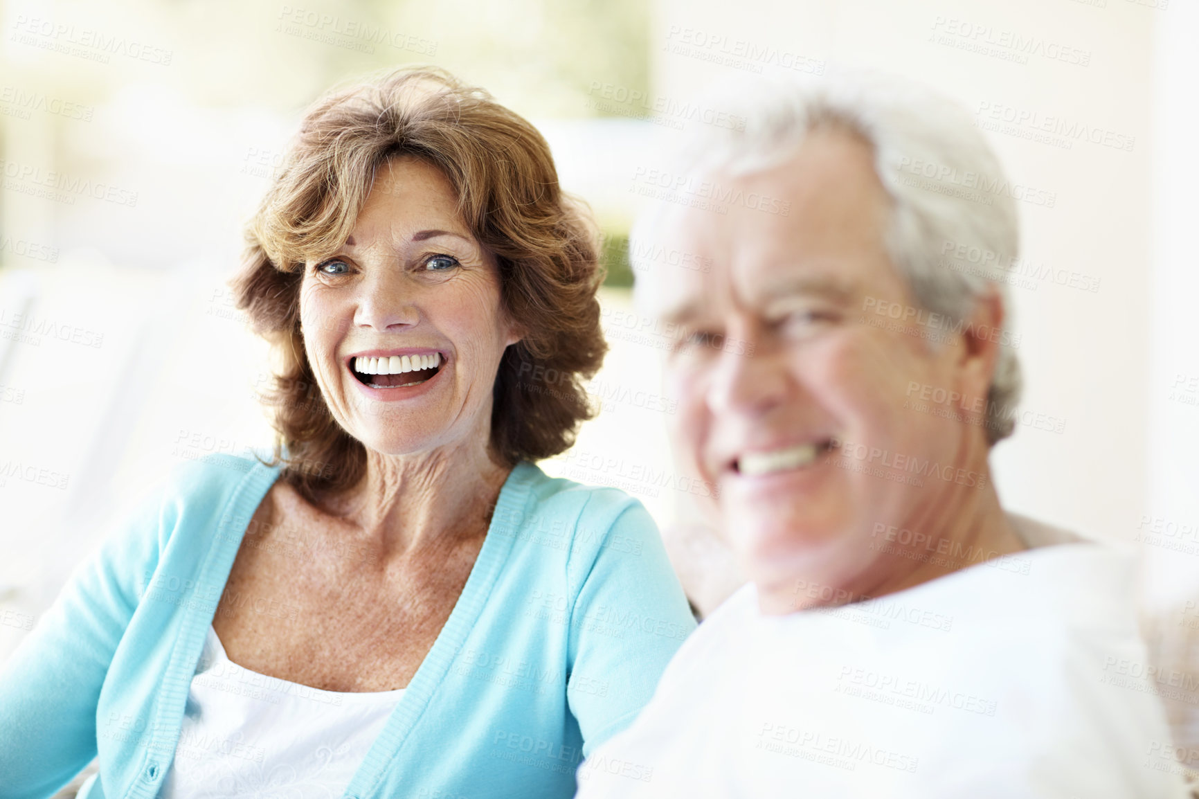 Buy stock photo Senior, woman and couple with portrait in home, happiness and relax with husband on sofa. Love, marriage and old person with partner in living room, smile and loyalty with retirement and relationship