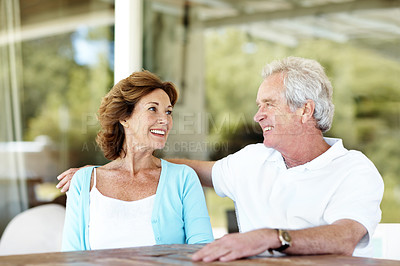 Buy stock photo Relax, happy and senior couple on patio for conversation, bonding and connection on weekend. Retirement, smile and man with woman in backyard for talking, relationship and love for marriage outdoor