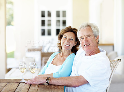 Buy stock photo Champagne, happy and portrait of senior couple in backyard by home for bonding, love and anniversary date. Smile, drink and elderly man with woman for connection, commitment and care in marriage.
