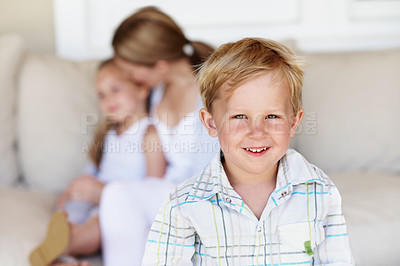 Buy stock photo Smile, relax and portrait of kid in home with childhood development, growth or bonding with family. Happy, calm and boy on sofa in living room with positive attitude, safety and trust in house.