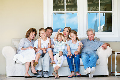 Buy stock photo Big family, portrait and kids on break, home and bonding with senior parents on weekend or together. Happy people, generations and connection with children on couch, men and women with smile at house