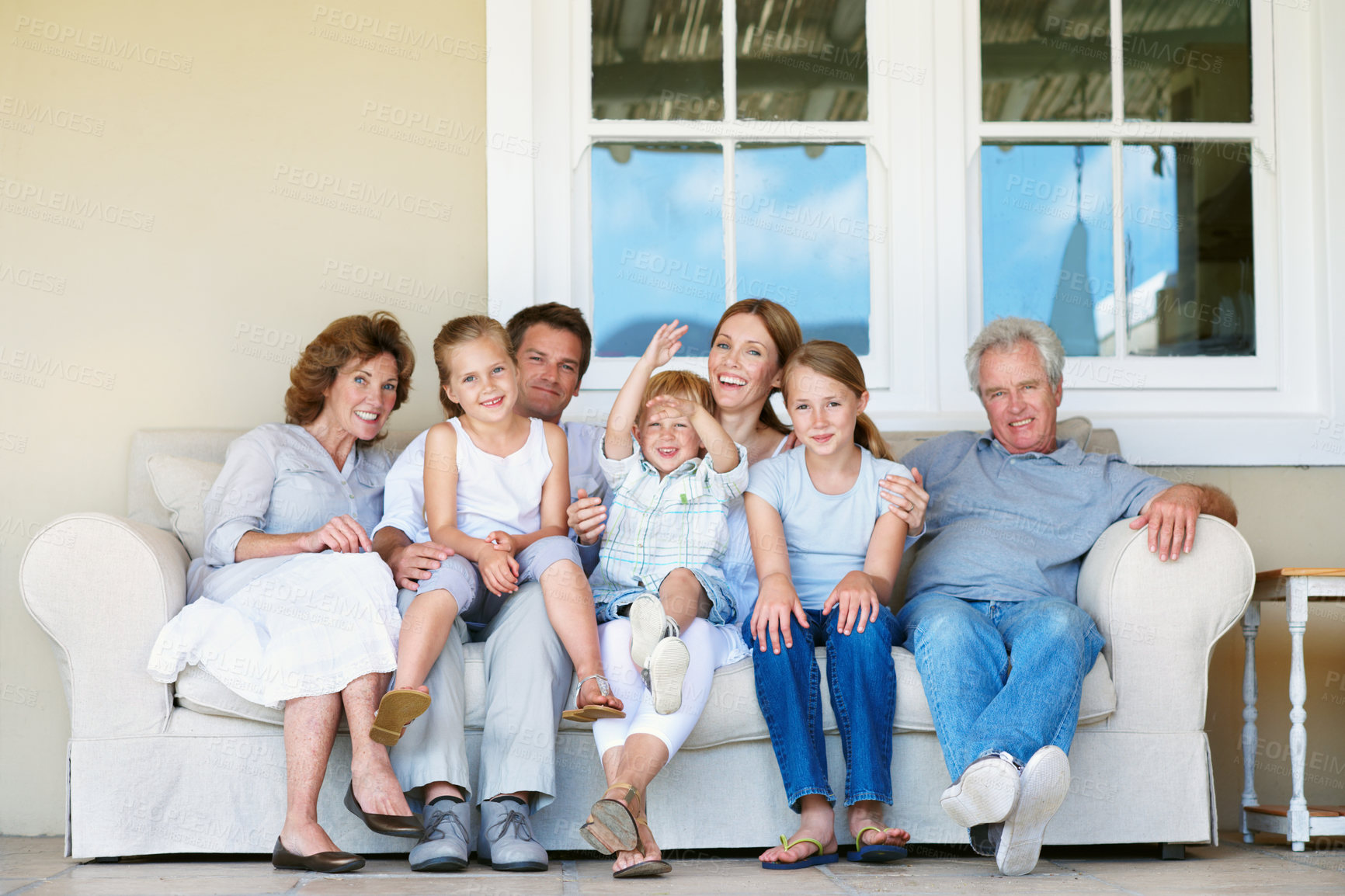 Buy stock photo Big family, portrait and kids on break, home and bonding with senior parents on weekend or together. Happy people, generations and connection with children on couch, men and women with smile at house
