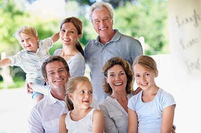 Buy stock photo Portrait, big family and group outdoor for bonding, love and care with generations on patio. Grandparents, parents and children with people on porch, happy and relax together for trust and memory