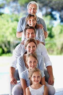 Buy stock photo Portrait, stack and family with children, home and bonding with senior parents on weekend or outdoor. Grandparents, together and connection with kids on break, generations and happy people pile