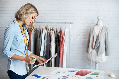 Buy stock photo A young designer creating a design in her office