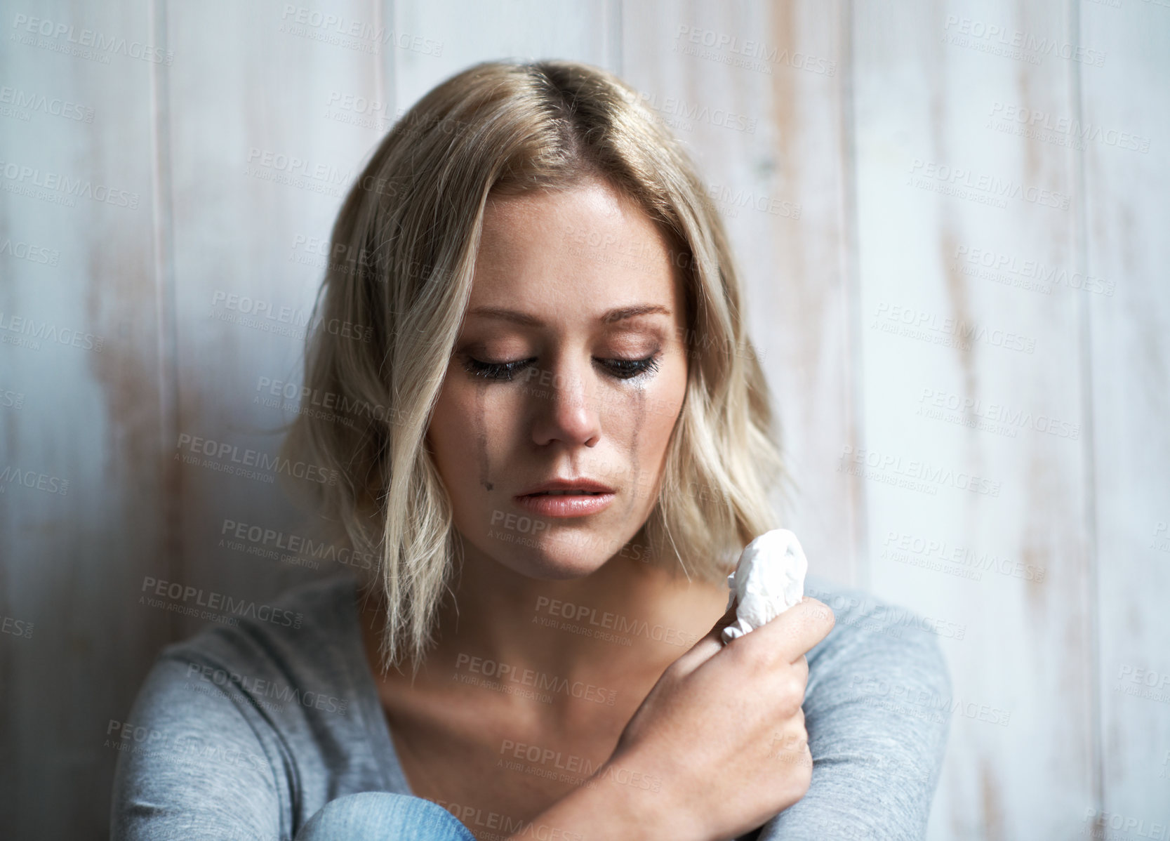 Buy stock photo Sad, crying and woman with depression and tissue for overthinking, emotional crisis and loss. Home, reflection and person with tear, upset and overwhelmed for trauma, grief and lonely for breakup
