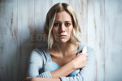 Buy stock photo Portrait of a pretty young blonde woman with mascara running down her face after crying