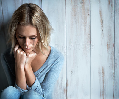 Buy stock photo High-angle view of a young woman with mascara tears running down her face