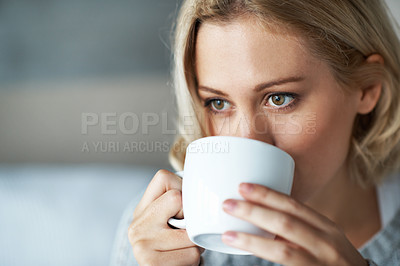 Buy stock photo Closeup of a pretty young blonde woman drinking a mug of coffee