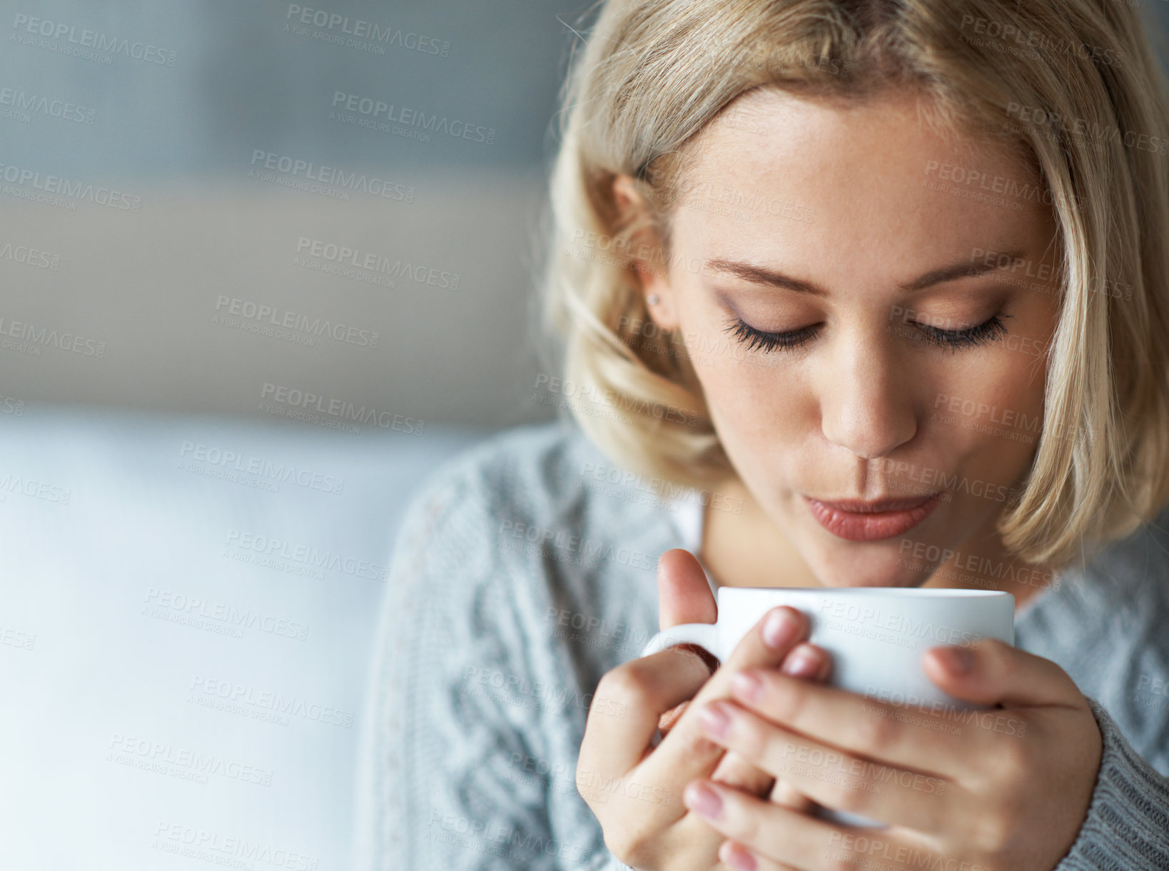 Buy stock photo Coffee, blowing and woman in home with drink for calm, peaceful and warmth for comfort. House, morning and person with hot beverage, cup and caffeine for wellness, relax and unwind on weekend