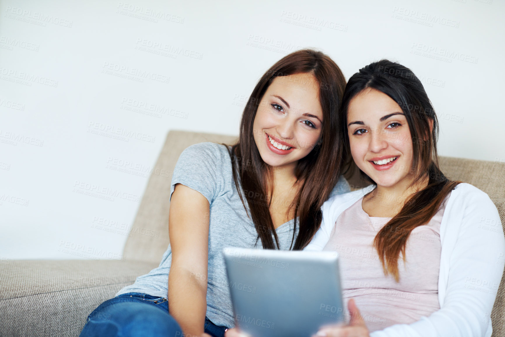 Buy stock photo Happy, friends and teen with tablet in home, bonding and streaming movies on social media in lounge. Portrait, smile and people with app subscription, entertainment and relax with technology in house