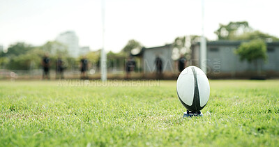 Buy stock photo Rugby, space and sports with ball on grass field for aim, conversion or point scoring opportunity. Balance, points and tee with equipment outdoor on pitch for target of competition, game or match
