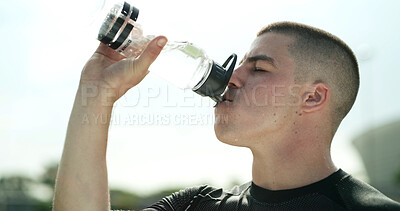 Buy stock photo Rugby, man or drinking water outdoor for health, wellness and electrolytes on workout break. Hydration, sports or person with bottle for exercise, fitness or tired with sweat for training recovery