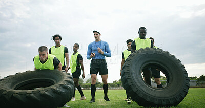 Buy stock photo Workout, coach and people with tire on field, strength challenge and training for sport competition. Coaching, trainer or rugby team with exercise for muscle development, active or weightlifting