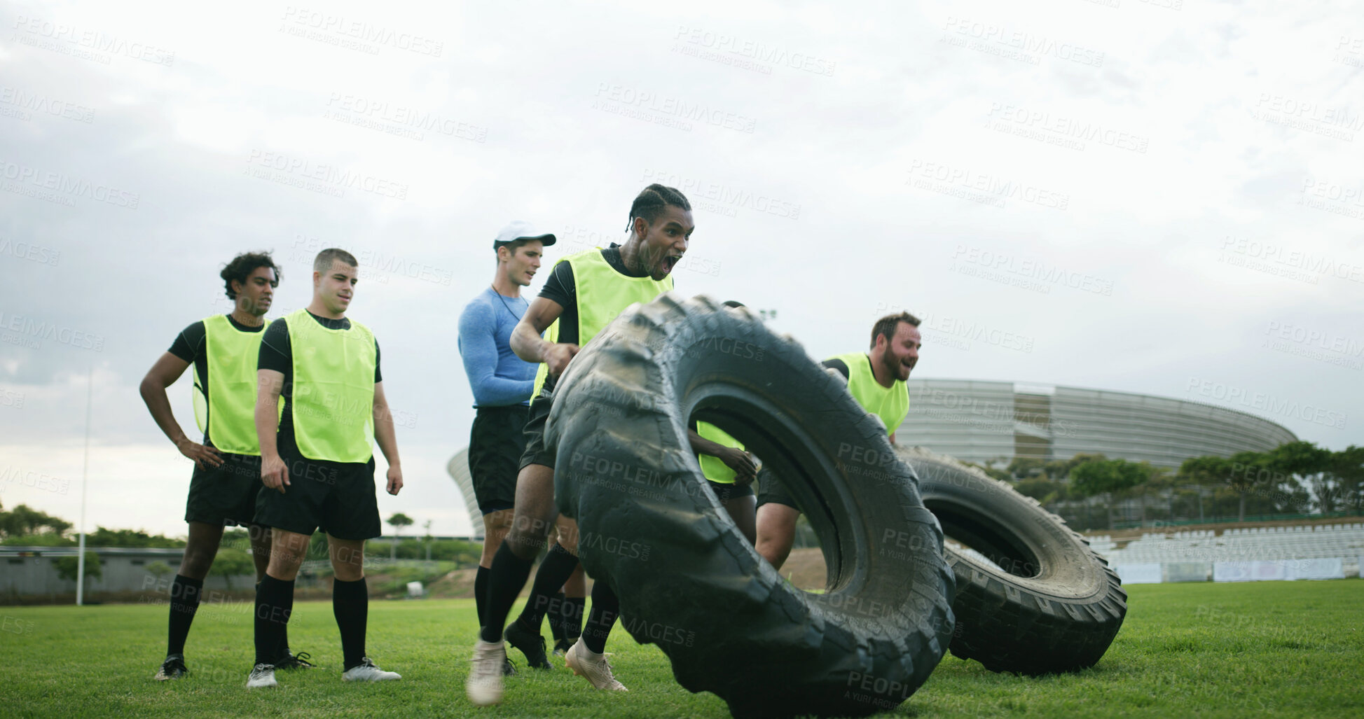 Buy stock photo Training, coach and people with tire on field, strength challenge and workout for sport competition. Space, trainer or rugby team with fitness exercise for muscle development, active or weightlifting
