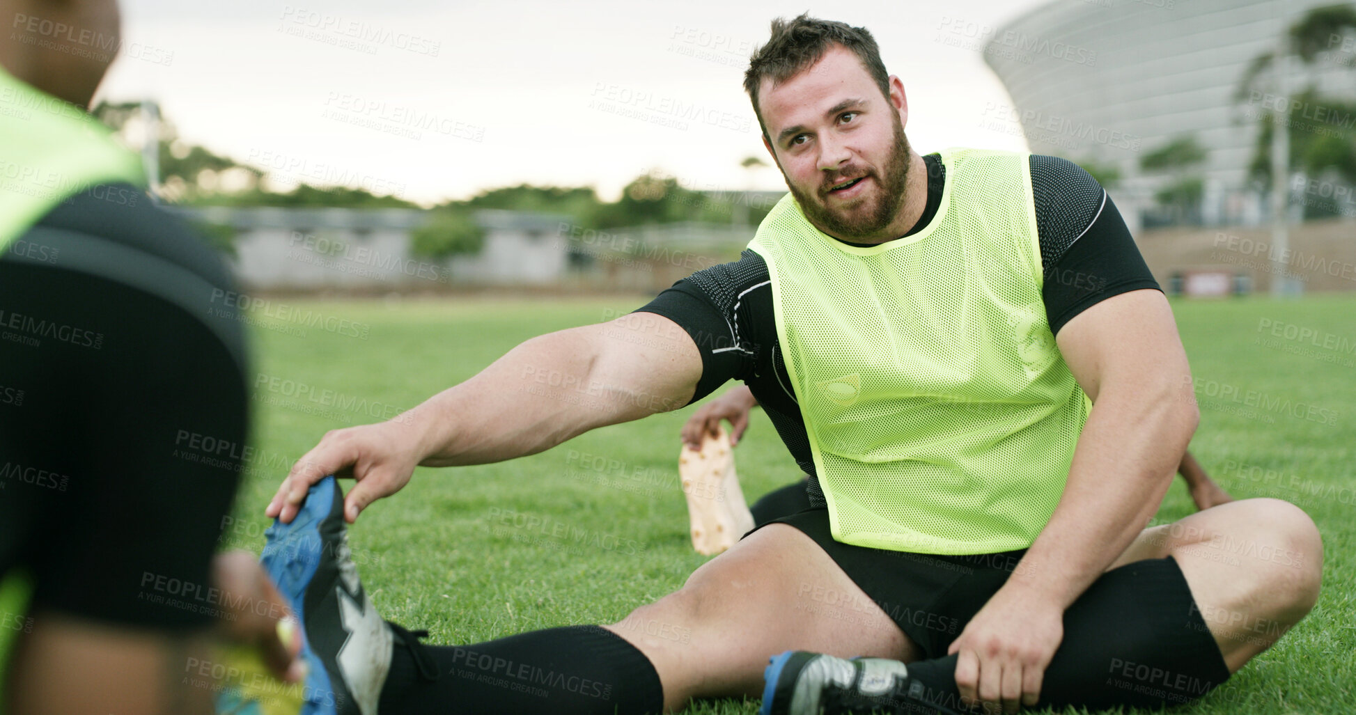 Buy stock photo Stretching, team or man with practice on field, sports training or warm up routine for preparation. Outdoor, players or people with leg exercise for mobility, rugby club or getting ready for game