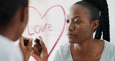 Buy stock photo Love, mirror and black woman with lipstick for writing in home with affirmations and self care in morning. Heart, drawing and female person with makeup note for motivational message in house.