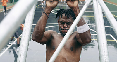 Buy stock photo Athlete, man and play game on basketball court with fitness, practice skills and hang from structure. Active, black person and sports match outdoor with strength, exercise and workout for wellness.