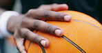 Basketball, sport and hands in court for competition, game or match on playground or park. Grip, male person or athlete on pitch with ball for training, exercise or tournament on fitness practice