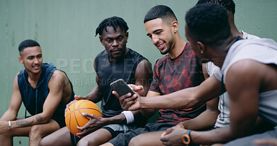 Buy stock photo Fitness, break or basketball team outdoor with phone, sports highlights or workout post on social media. Digital, men and athletes with tech, chat update or watching game footage on training pause.