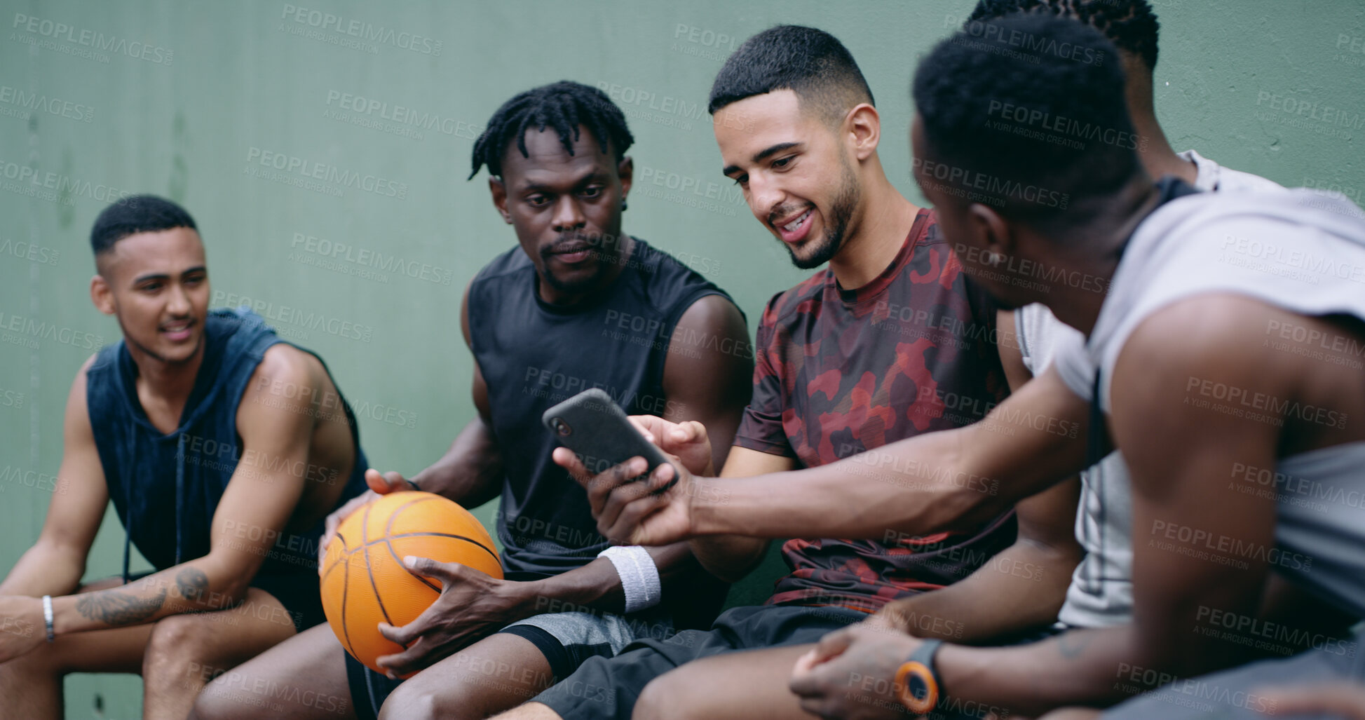 Buy stock photo Fitness, break or basketball team outdoor with phone, sports highlights or workout post on social media. Digital, men and athletes with tech, chat update or watching game footage on training pause.