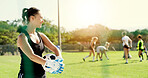 Thinking, woman and team on field for football practice, competition preparation and idea for warm up. Fitness, people and happy goalkeeper with soccer ball for sports training, vision and reflection