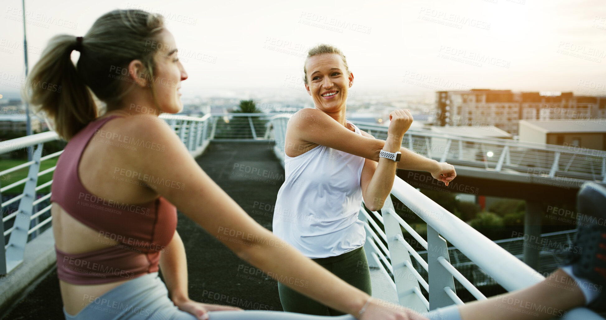 Buy stock photo Friends, fitness or women stretching on city bridge for outdoor workout preparation or exercise. Happy, active or female people getting ready with smile or body warm up for health or wellness in town