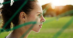Soccer, woman and thinking on field with fitness, game plan and athlete contemplating for practice. Bokeh, person and football player outdoor by net with vision, training and idea for sports tactics.