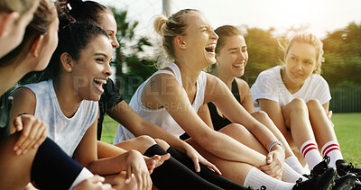 Buy stock photo Fitness, relax and team with laughing on field, soccer joke and bonding for sports training break. Football practice, friends and happy women with funny conversation for connection, humor and resting
