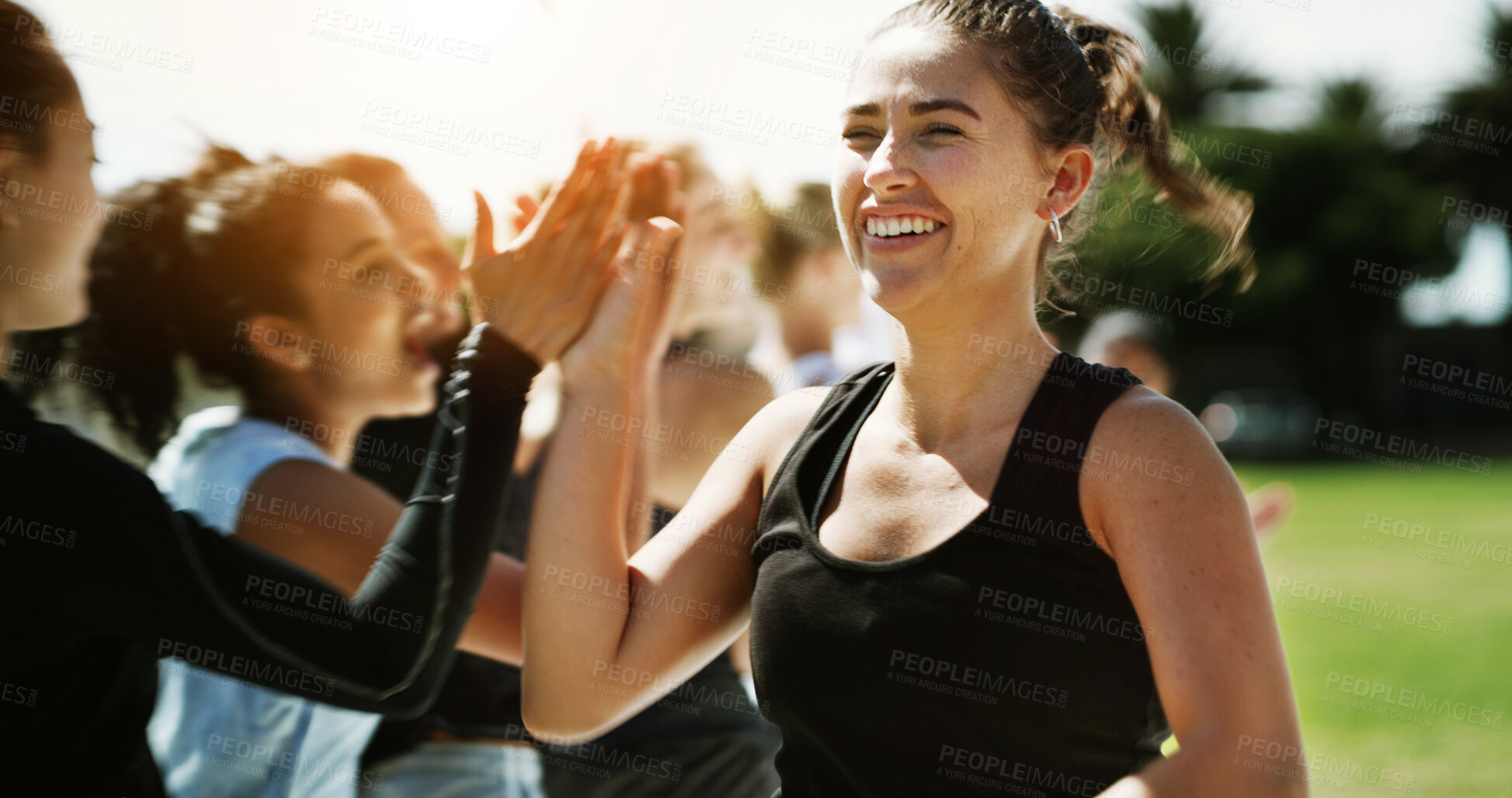 Buy stock photo Soccer, team and happy woman with high five for winning, goal or outdoor match on grass field. Excited, female person or football player with smile or success for score or point on sports pitch