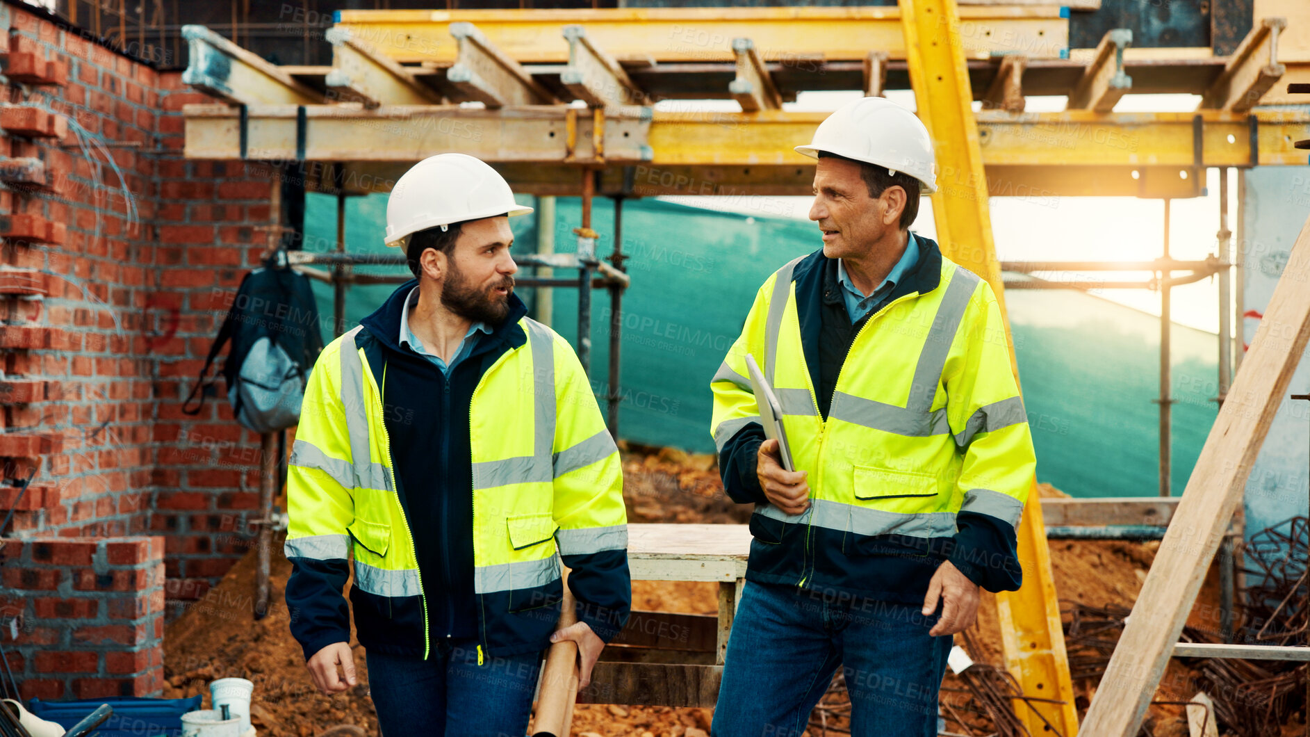 Buy stock photo Walk, architect and men in construction for site inspection, project planning and building safety. Team, people and tablet with blueprint outdoor for development progress, architecture and compliance