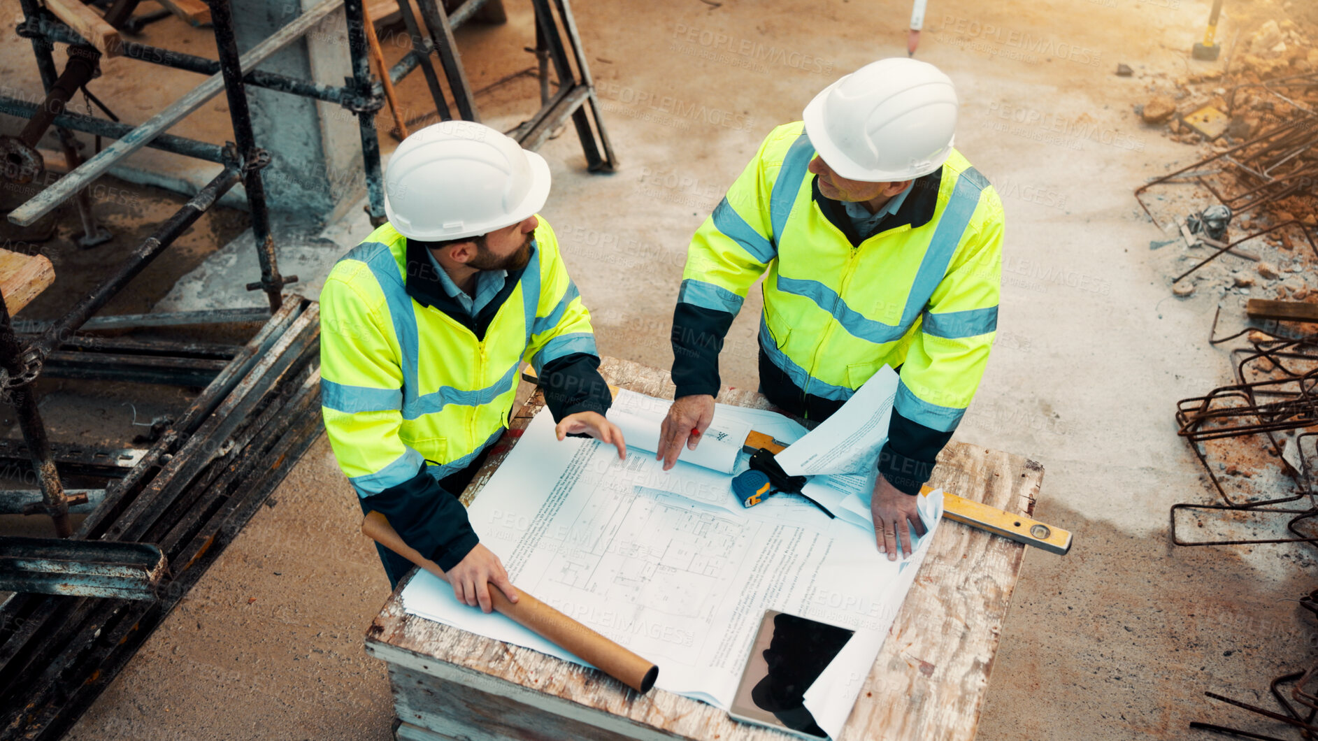 Buy stock photo Architect, men and talk with blueprint on site for design vision, building layout and compliance. Construction, architecture meeting and team with floor plan for structural review, progress and above