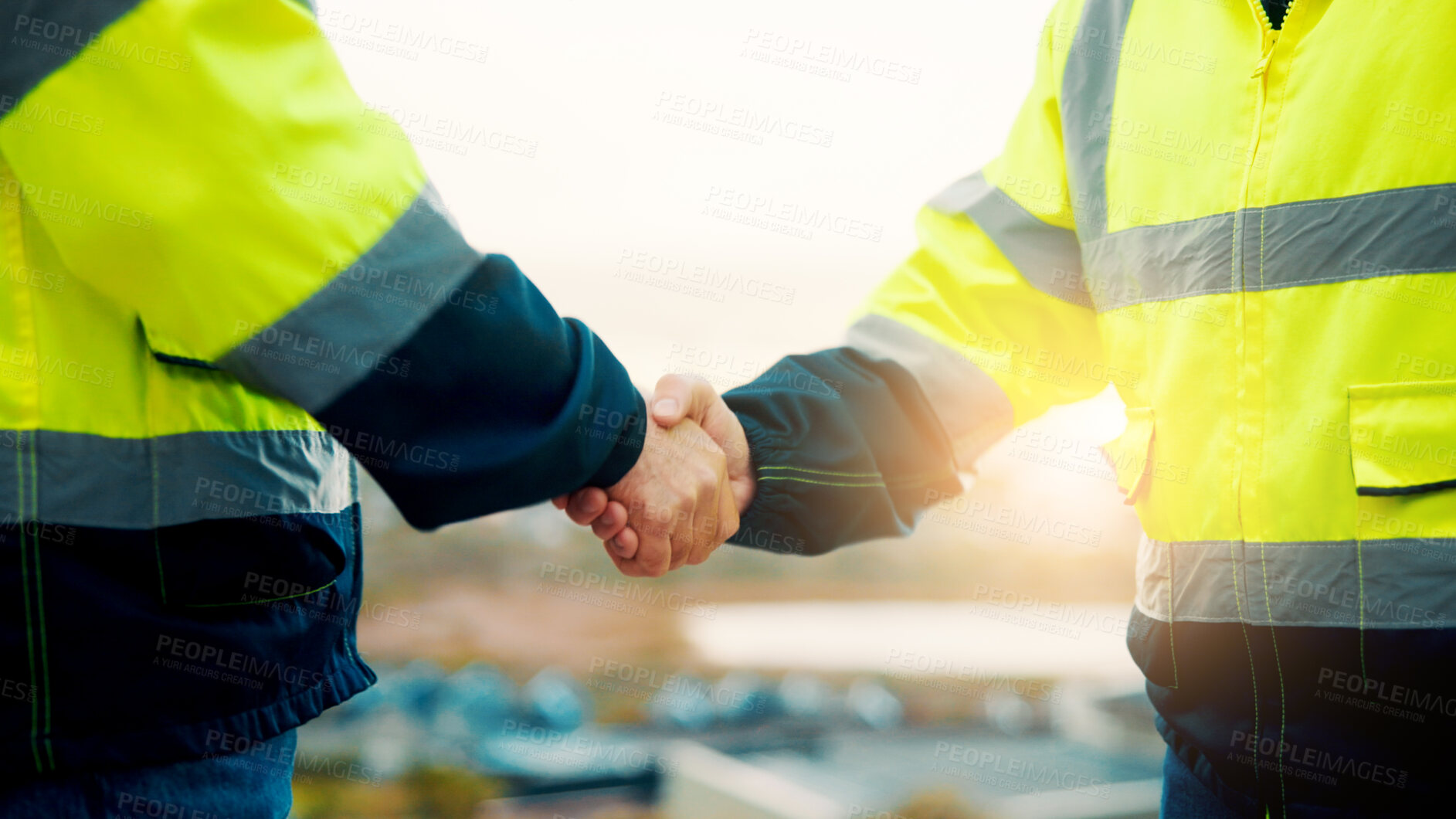 Buy stock photo People, engineer and meeting with handshake on rooftop for building deal or partnership in city. Contractor, builder or shaking hands with flare for teamwork or agreement on construction site