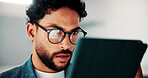 Tablet, glasses and businessman in office with research for finance report with revenue growth. Digital technology, reading and financial manager with feedback on investment proposal in workplace.