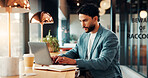 Laptop, finance and business man in cafe for remote work with proposal, online report and budget. Restaurant, typing and person on computer for financial review, investment research and planning