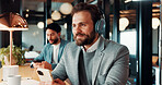 Businessman, smile and think with headphones in cafe, real estate agent and music choice with phone. Coffee shop, realtor and person with mobile for song selection, reflection and listening to audio