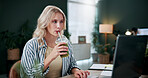 Creative, woman and smoothie in office with laptop, review project and research for digital marketing. Female person, tech and coworking in agency with beverage, proposal and advertising campaign