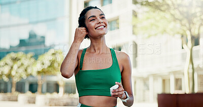Buy stock photo Happy, athlete and woman with earphones in city, wellness and streaming music for physical activity. Outdoor, fitness and person with tech for sound, thinking and bodybuilder with audio subscription